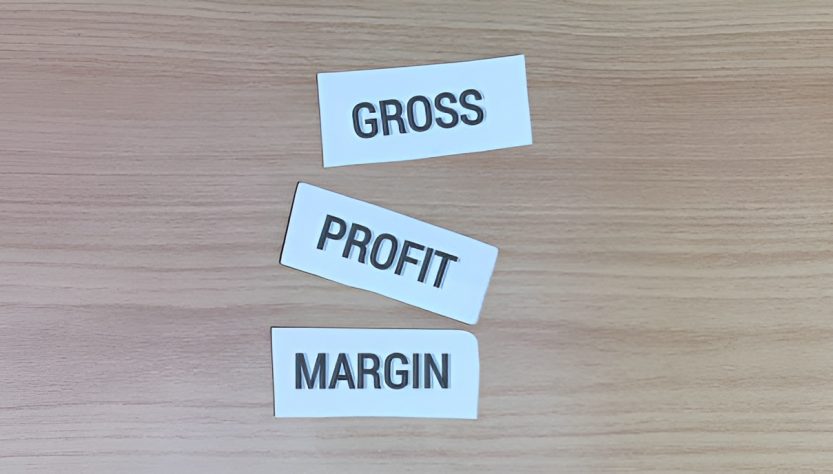 three sticky notes labeled 'gross,' 'profit,' and 'margin'